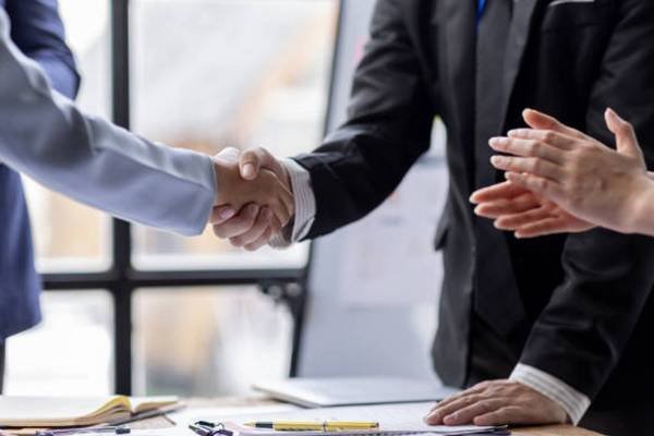 Business Team offer and give hand for handshake in office. Successful job interview. Apply for loan in bank. Salesman, bank worker or lawyer shake for deal, agreement or sale. Increase of salary.