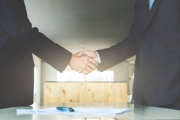 business ceo hands shaking while meeting selected focus on hands